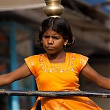 Concentration of a young street performer balancing on a tight-rope, Munnar, Kerala