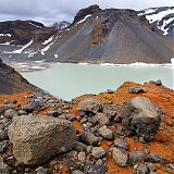 Colourful volcanic rock and lagoon at Þórisjökull glacier