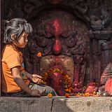 Young Nepalese girl at Hindu shrine, image: Stu Holmes