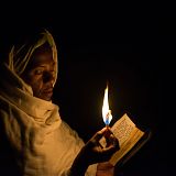 Pilgrim with bible and candle, Lalibela