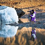 Photographer at a glacier lagoon