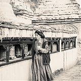 Local woman, prayer wheels