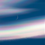 Moon behind nacreous clouds