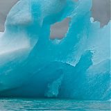 Bizarrely shaped iceberg floating in the glacier lagoon