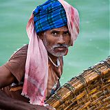 Fisherman with coracle boat, Sathnur Dam, near Tiruvanamalai, South India