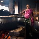 Woman cooking Dhal over an open wood fire, near Gingee, Tamil Nadu, South India