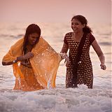 Indians bathing in the ocean